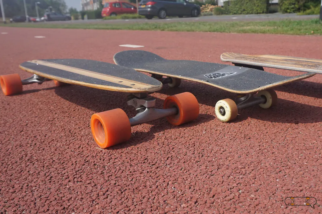longboard next to a skateboard